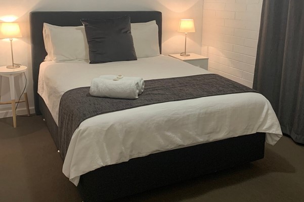 Archipelago Apartments - standard bedroom bed